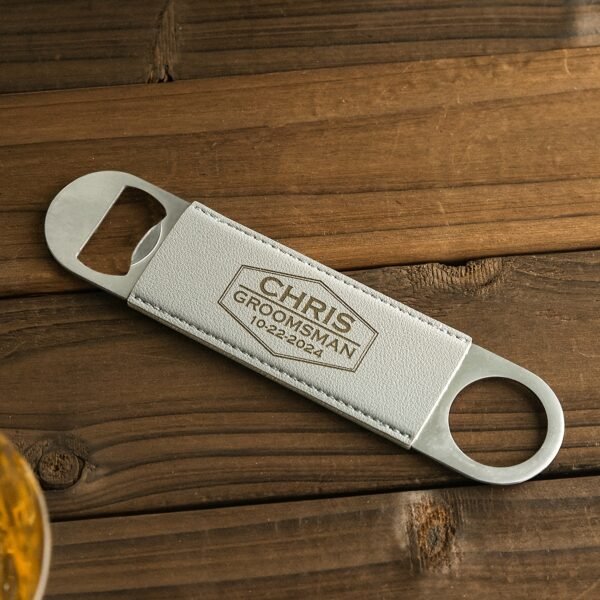 Custom metal beverage opener with personalized name engraving.