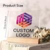 Customizable acrylic logo plaque with a wooden stand.