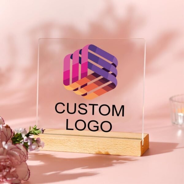 Customizable acrylic logo plaque with a wooden stand.