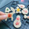 12-piece stainless steel Christmas cookie cutter set for festive baking.