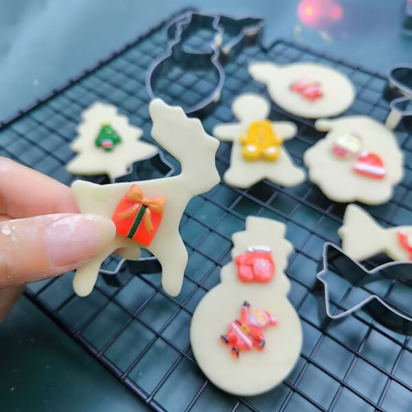 12-piece stainless steel Christmas cookie cutter set for festive baking.