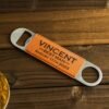 Custom metal beverage opener with personalized name engraving.
