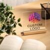 Customizable acrylic logo plaque with a wooden stand.
