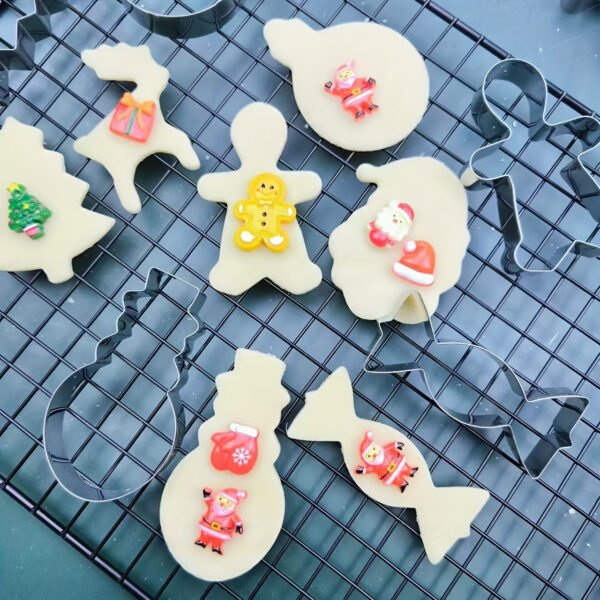 12-piece stainless steel Christmas cookie cutter set for festive baking.