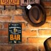 Personalized metal bar sign, ideal for wall hanging in a home pub.